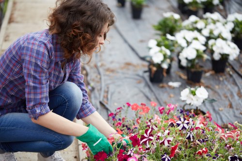 Landscape worker preparing a garden project with tools and materials
